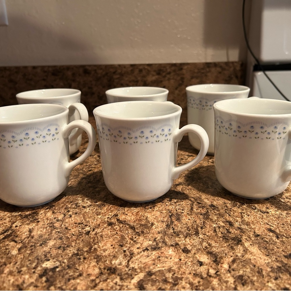 White and Blue Patterned Coring ware mugs